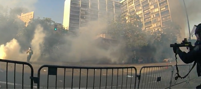 Officer with less lethal launcher, cloud of teargas at 8th & Broadway on June 1, 2022